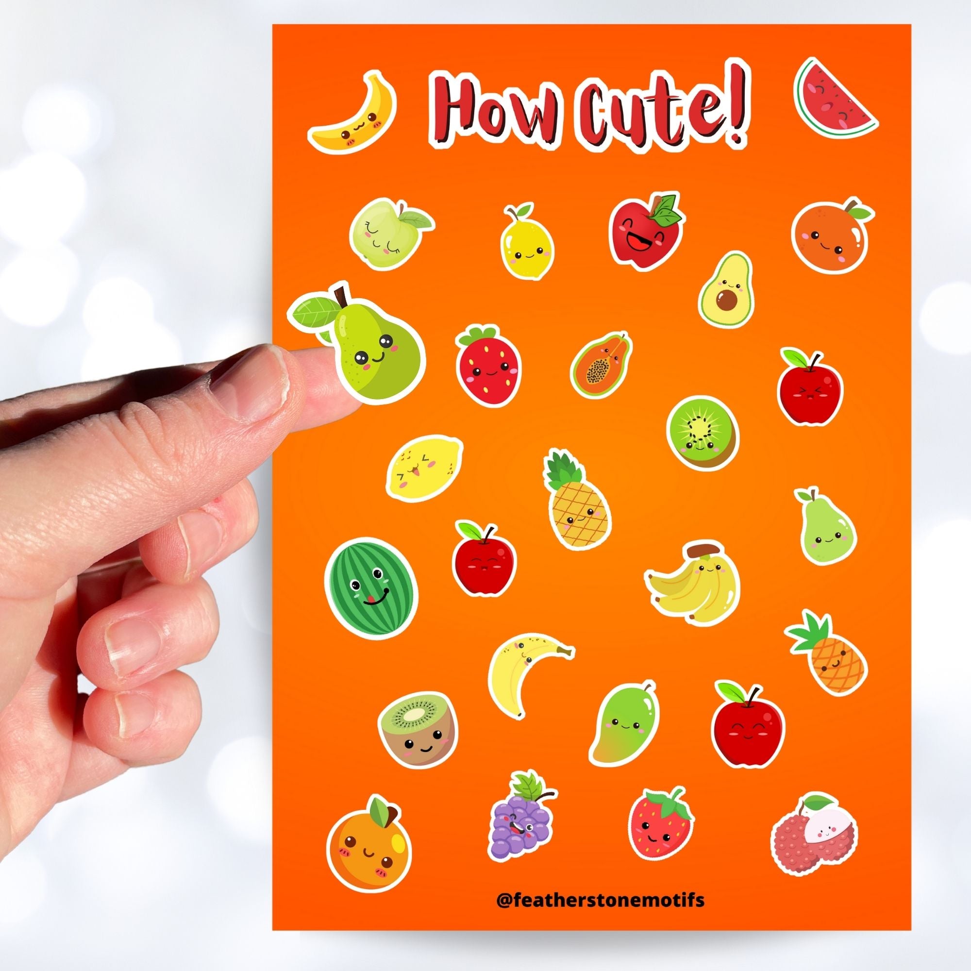 Filled with sticker images of cute fruit, this sticker sheet is sure to put a smile on anyone's face! This image shows a hand holding a sticker of a smiling pear over the sticker sheet.