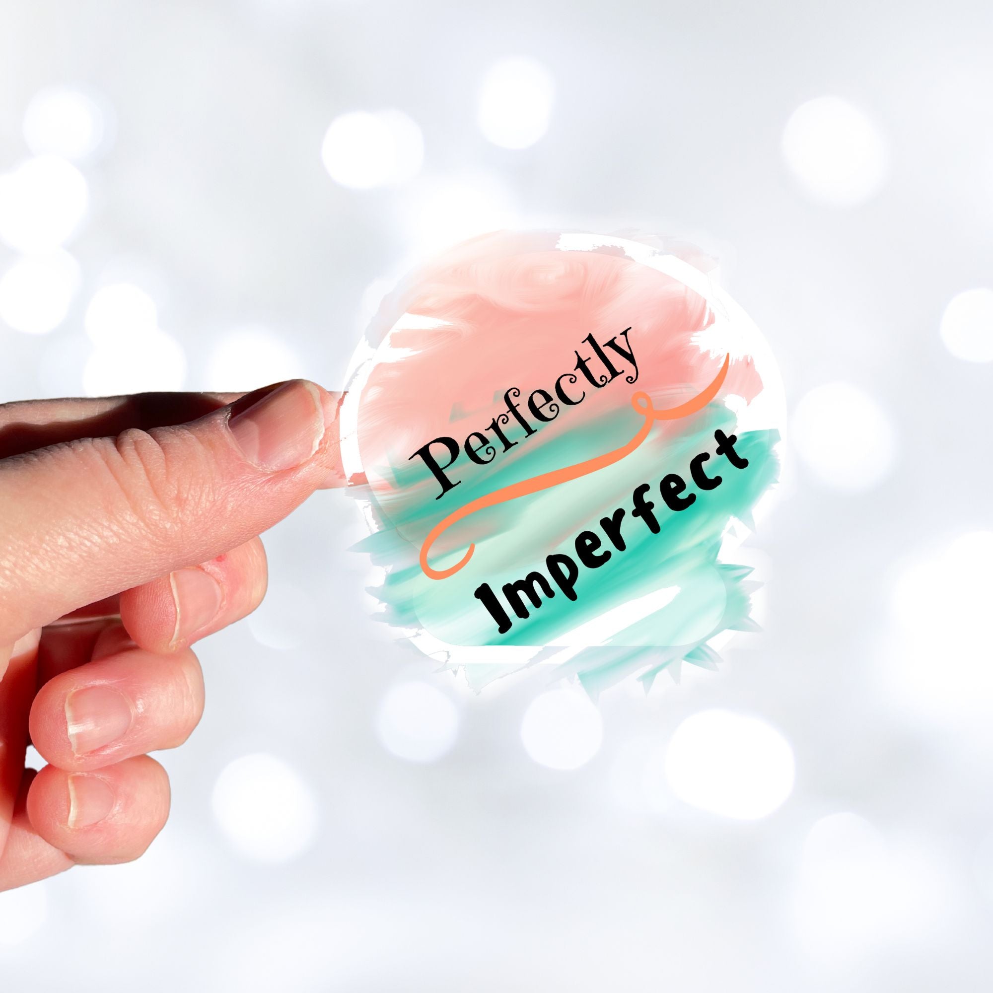 When you think about it, we're ALL Perfectly Imperfect! This inspirational die-cut sticker features the words Perfectly Imperfect on a cloudy pastel background. Check out our Inspirational collection for more inspiring stickers! This image shows a hand holding the Perfectly Imperfect sticker.