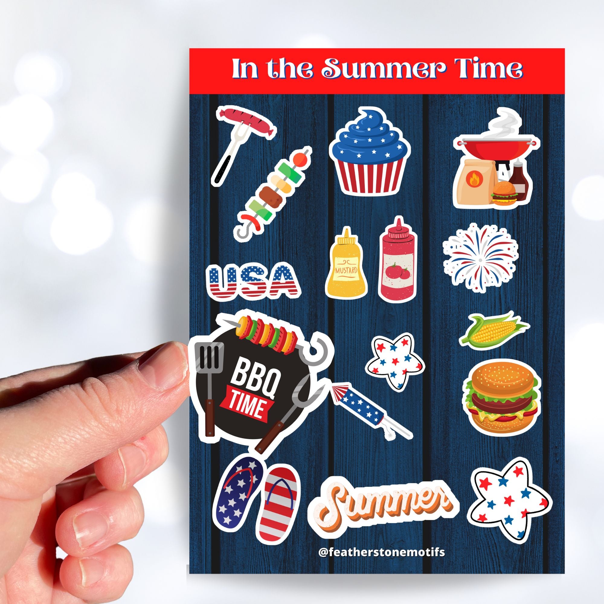 Celebrate summer, and the 4th of July in the USA. This sticker sheet has all of your favorite summer time foods like BBQing, burgers, hot dogs, and corn on the cob. Plus fireworks and red, white, and blue images. This image shows a hand holding a sticker of a grill (or BBQ) over the sticker sheet.