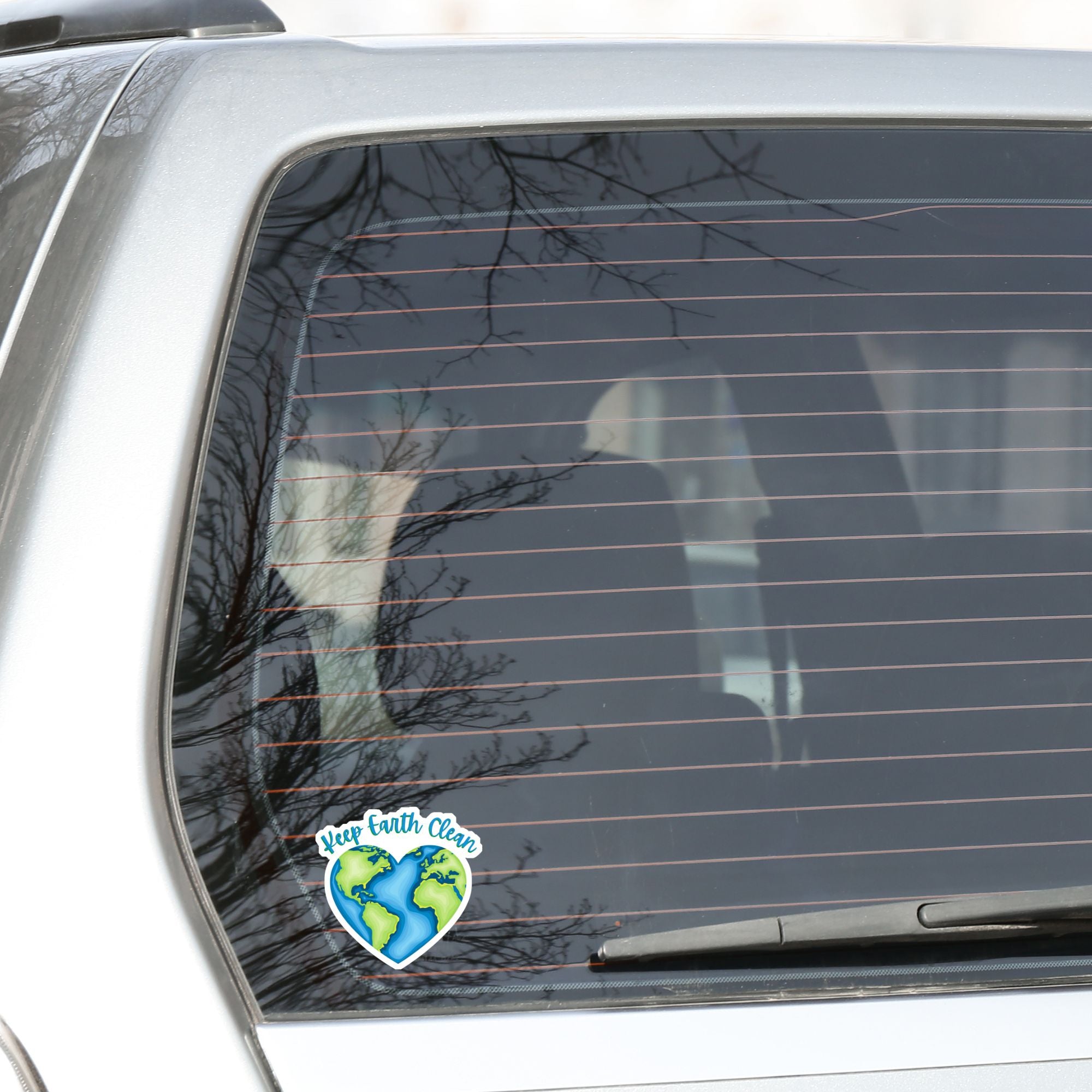 Keep Earth Clean, it's the only home we have! This individual die-cut sticker features the earth in a heart shape with Keep Earth Clean written above. Check out our Inspirational collection for more inspiring stickers! This image shows the Keep Earth Clean die-cut sticker on the back window of a car.