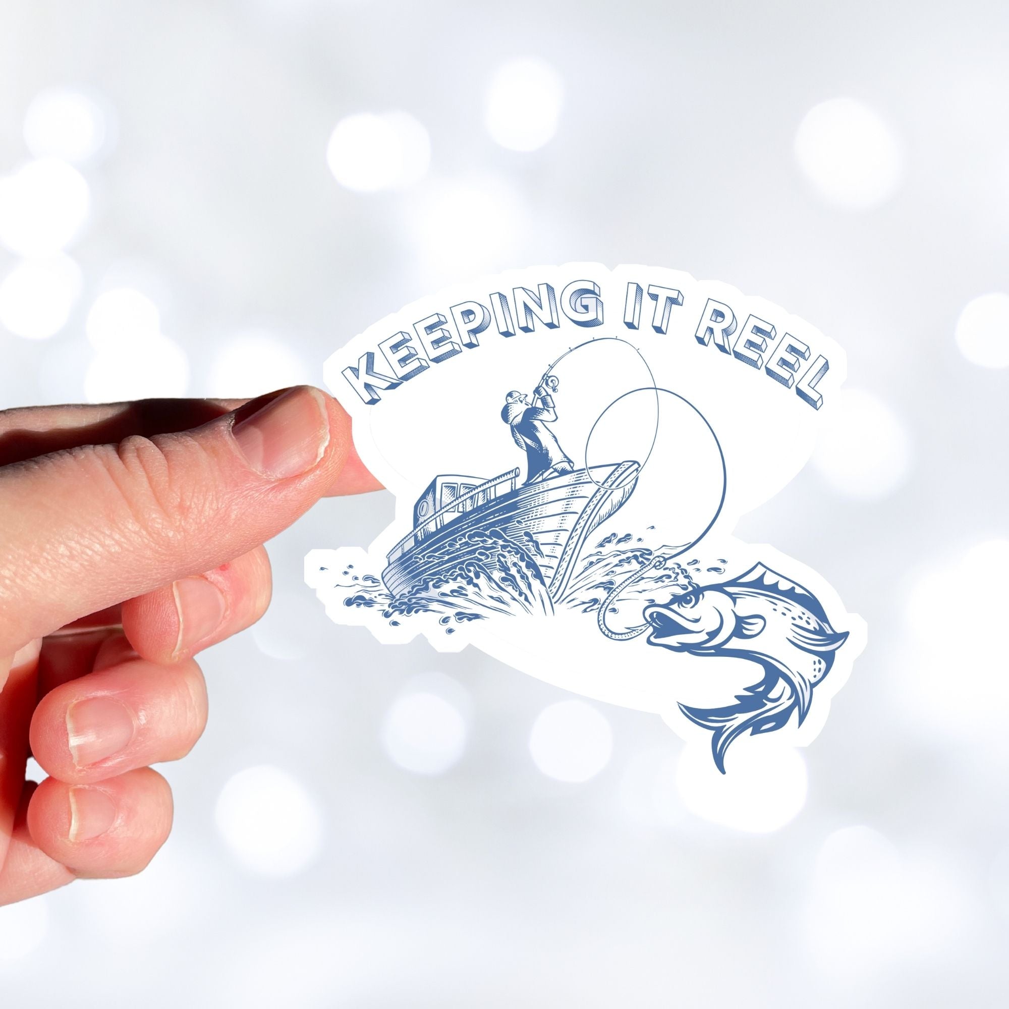 Love fishing? Then this individual die-cut sticker of a fisherperson with one on the line is for you! This image shows a hand holding the Keeping it Reel sticker.