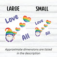 Load image into Gallery viewer, This gnome is showing his Pride! With the words "Love All", this individual die-cut sticker features a gnome with a rainbow hat and rainbow heart balloons. This image shows large and small Gnome Love All stickers next to each other.
