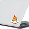 Load image into Gallery viewer, Aww, Love Birds! This individual die-cut sticker features a pair of love birds with hearts above. This is a perfect gift for your love bird! This image shows the Love Birds die-cut sticker on the back of an open laptop.
