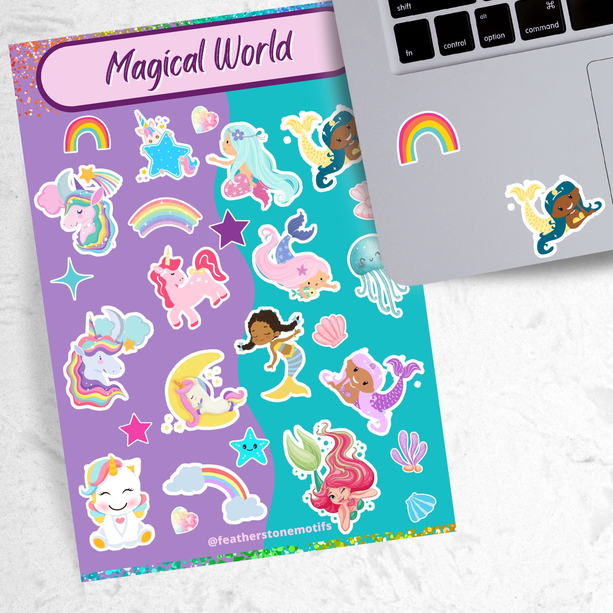 Mermaids, rainbows, and unicorns; it's our Magical World sparkle sticker sheet! This sticker sheet is filled with fun and cute magical images, and it has a sparkle overlay so it glitters in the light! This image is of the sparkle sticker sheet next to an open laptop with rainbow and mermaid stickers applied below the keyboard.