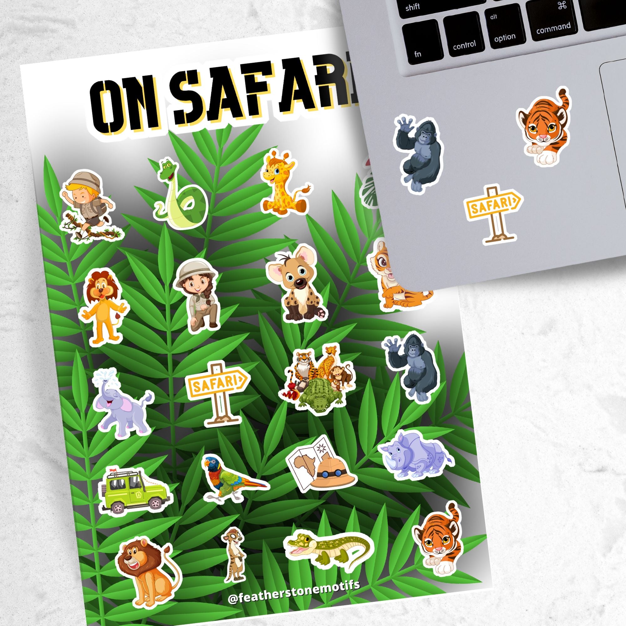 Who's ready to go "On Safari"? This jungle themed sticker sheet has images of your favorite jungle creatures, kid explorers, and all the things you need for your next jungle adventure!  This image shows the On Safari sticker sheet next to a laptop with stickers of a gorilla, tiger, and Safari sign applied below the keyboard.