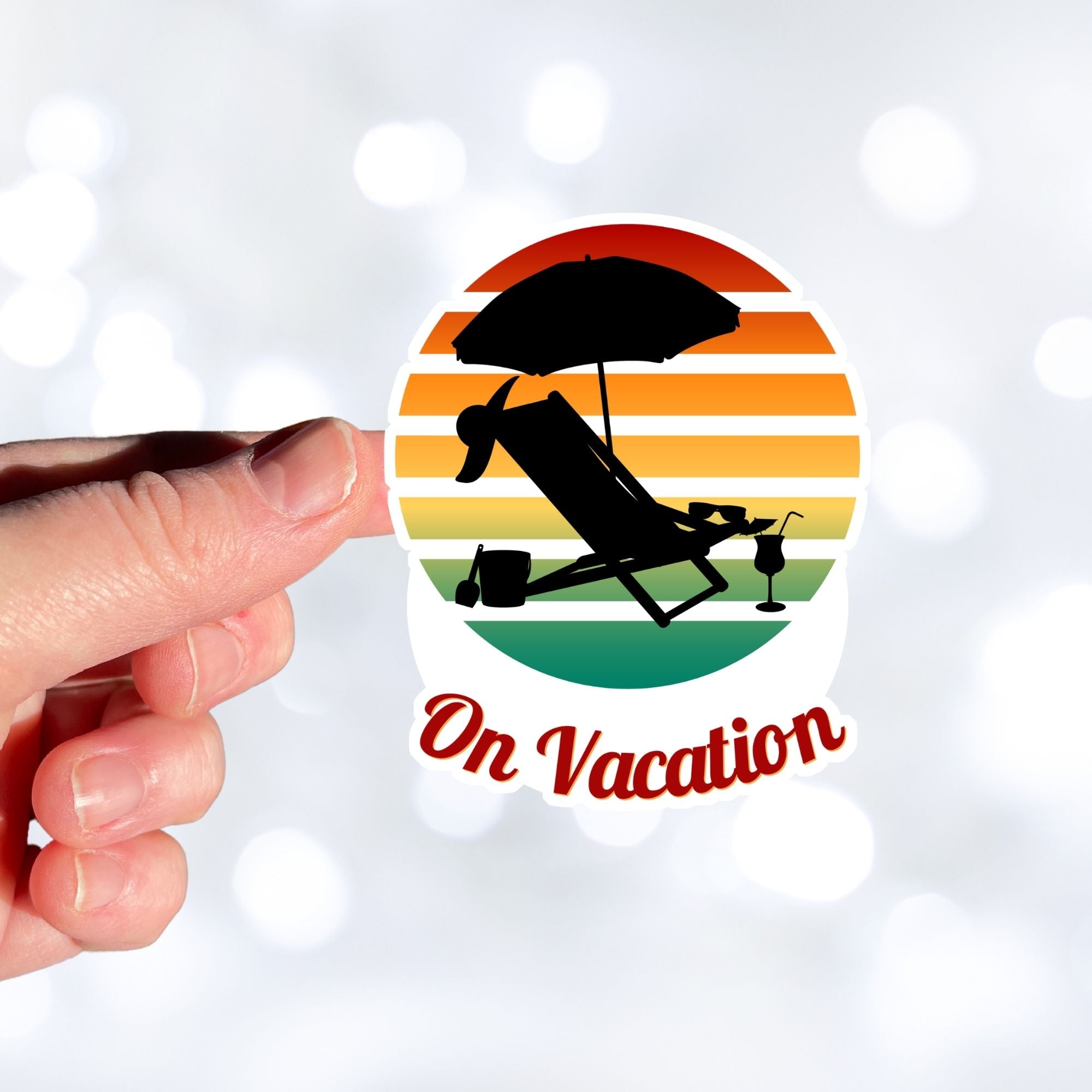 Who doesn't want to be on vacation? Whether you travel or just stay around home, being on vacation sure beats the alternative! This individual die-cut sticker features the silhouette of a beach chair and umbrella with a cool tropical beverage easily at hand, all on a colored gradient background. Relax, you're On Vacation! This image shows a hand holding the On Vacation sticker.