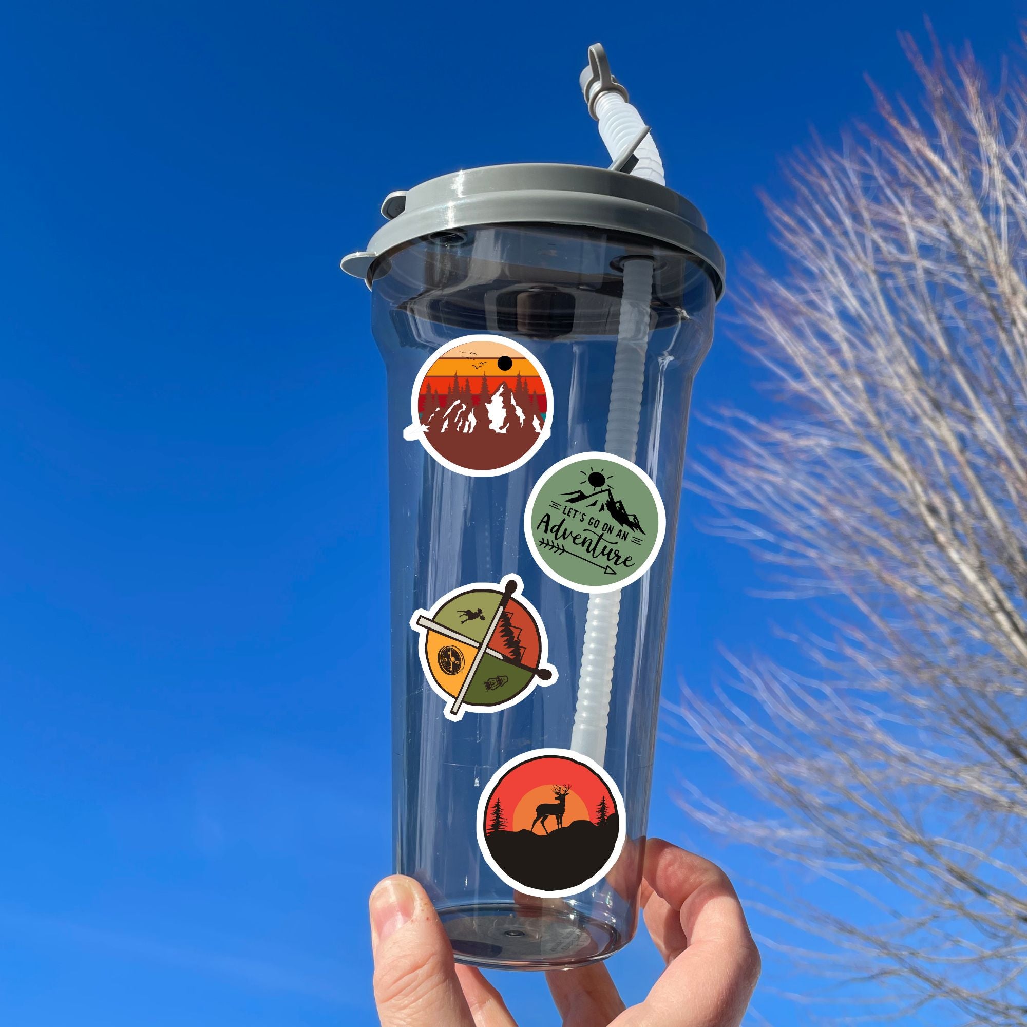 Tie up your boots and enter the wild with this sticker sheet! This sticker sheet has twelve different stickers showing different outdoor activities. From the mountains to camping to climbing this set is perfect for any outdoors person. This image is of a water bottle with four different outdoor stickers applied to it.