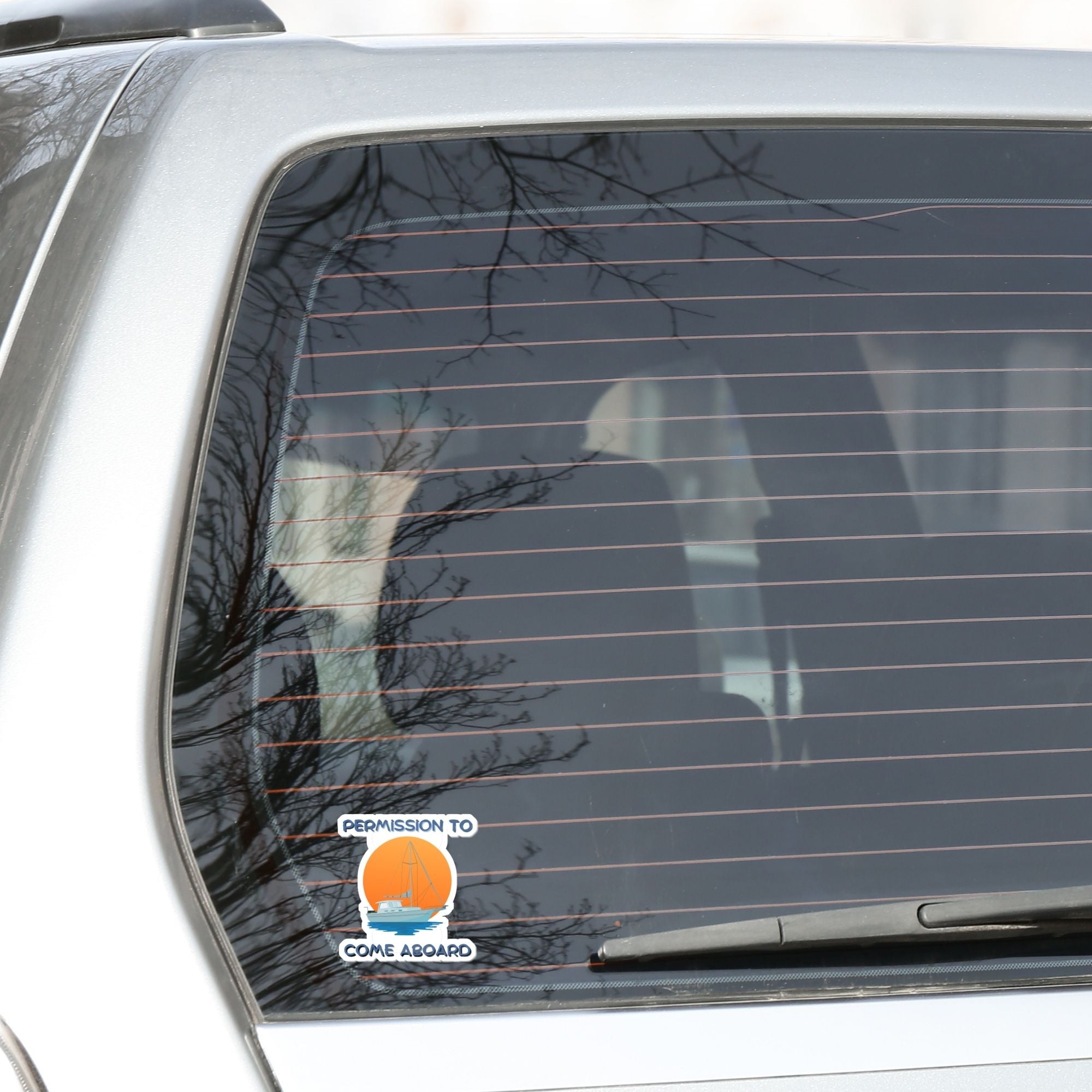 Ahoy Captain, permission to come aboard? This individual die-cut sticker has an anchored sailboat against a beautiful sunset. Perfect for sailors and boaters, this sailing sticker just feels relaxing! This image shows the Permission to Come Aboard sticker on the back window of a car.