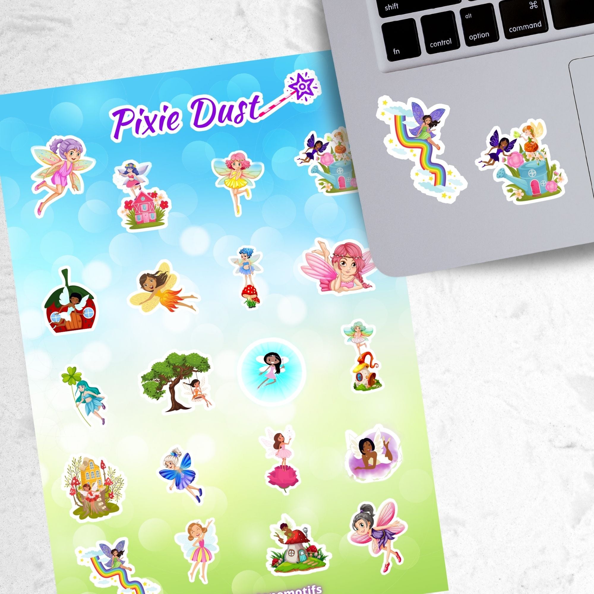 This sticker sheet has 20 different sticker images of fairies and it features a holographic sparkle overlay to give it that magical feel. This image shows the sticker sheet next to an open laptop with stickers of a fairy sliding down a twisty rainbow, and two fairies above a watering can house with flowers growing out of it, applied below the keyboard. 