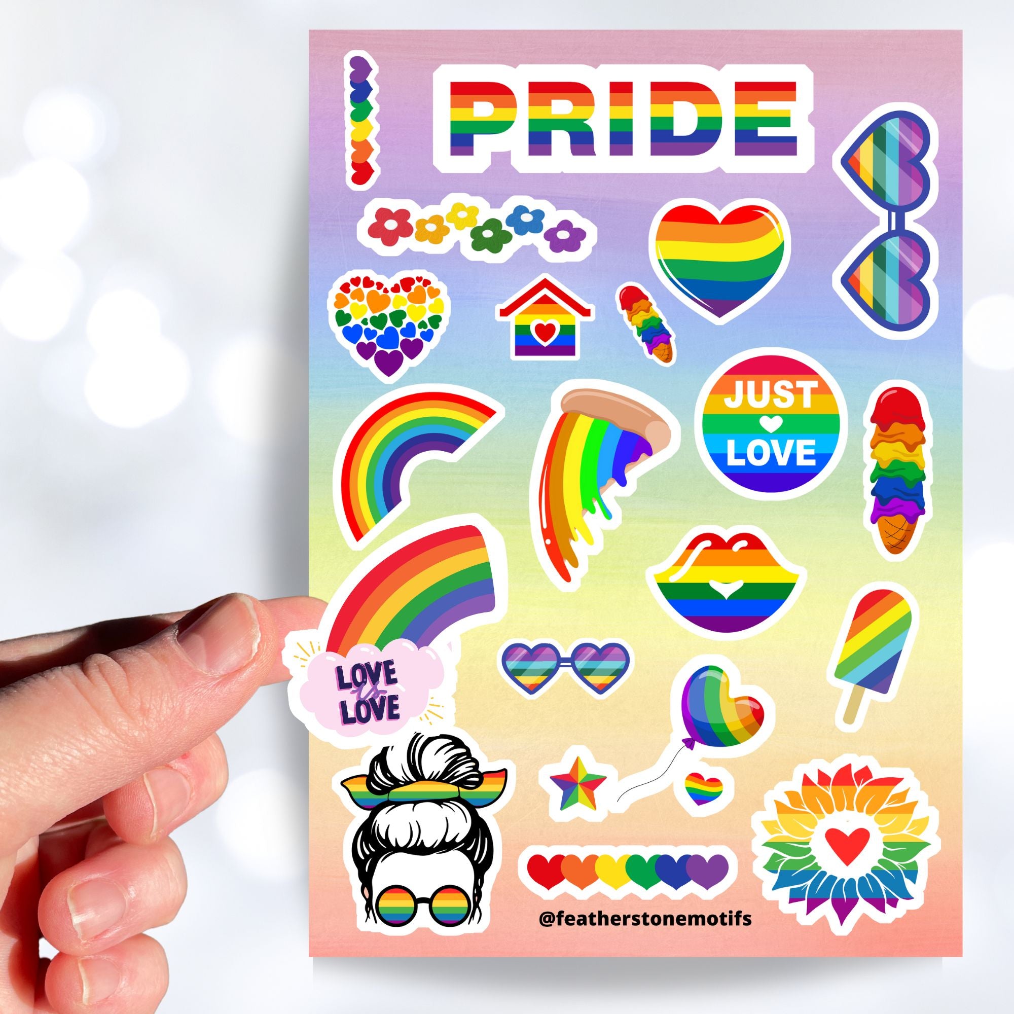Show your LGBTQ Pride with this sticker sheet! This sticker sheet is filled with rainbow Pride images that are perfect for anywhere you want to show your Pride. This image is of a hand holding a Rainbow Love is Love sticker above the sticker sheet.