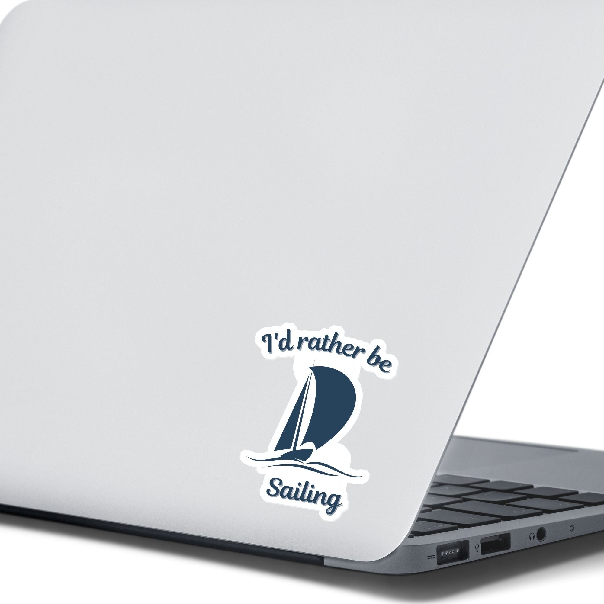 This individual die-cut sticker is great for anyone who loves to sail! It features a blue sailboat with the words "I'd rather be Sailing". This sailing sticker is understated, but says a lot! This image shows the I'd rather be Sailing sticker on the back of an open laptop.