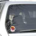 Load image into Gallery viewer, Grab your off-road bicycle and hit the trails! This individual die-cut sticker features the silhouette of a mountain biker flying above mountains, on an orange and white gradient background, with the words "Ready to Shred" below. This image shows the mountain bike sticker on the rear window of a car.
