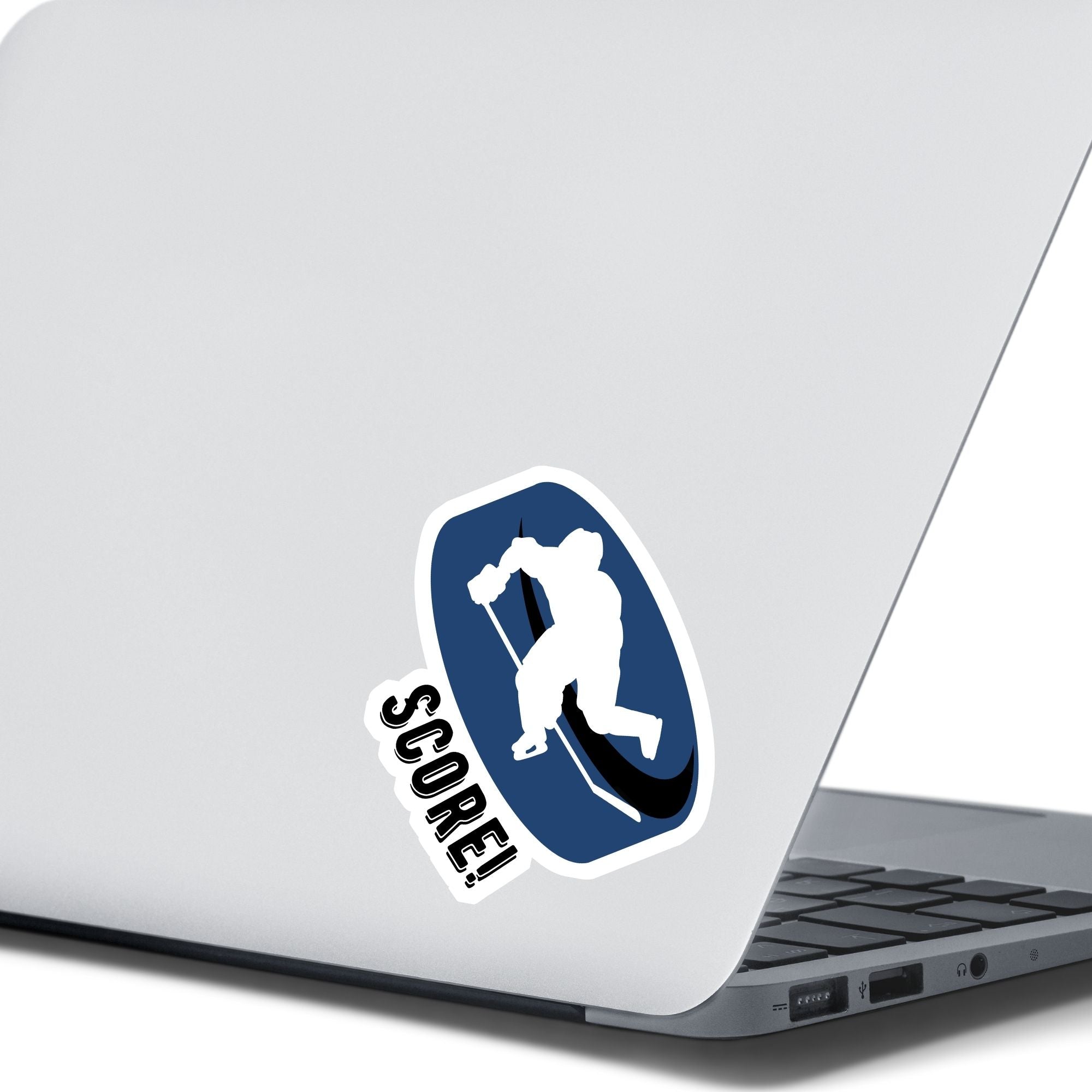 Grab your stick, lace up your skates, and head to the rink! This individual die-cut sticker features a hockey player silhouette on a blue hockey puck with the word "Score!" on the lower left side. This image shows the hockey sticker on the back of an open laptop.
