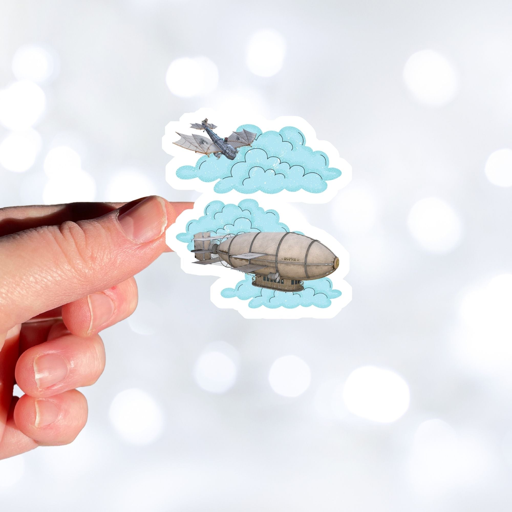 Is it a battle in the sky or is the plane coming to help out the blimp? This individual die-cut steampunk sticker features a steampunk plane diving through the clouds towards a steampunk dirigible. This image shows a hand holding the steampunk flyers sticker.