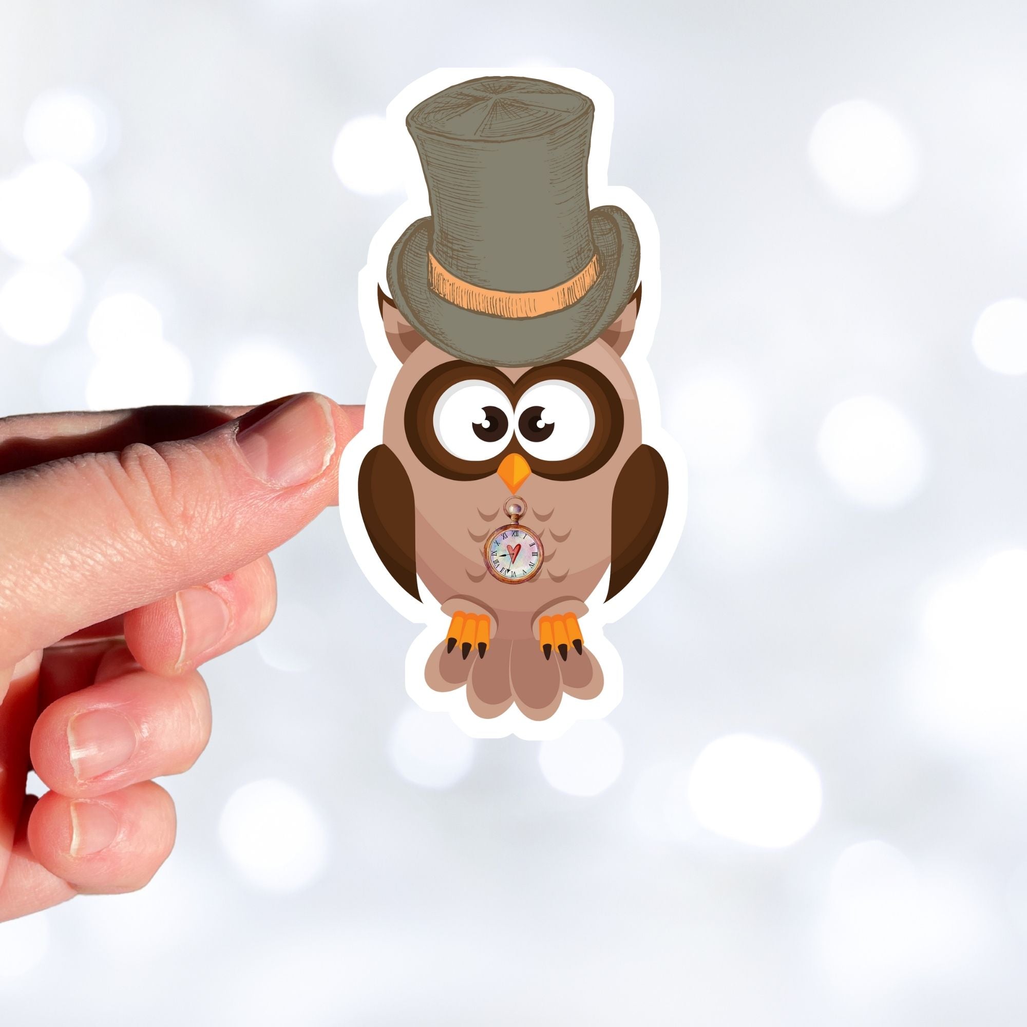 Mr. Owl is a distinguished looking steampunk owl with top hat and a pocket watch medallion. This image shows Mr. Owl being held above a white background