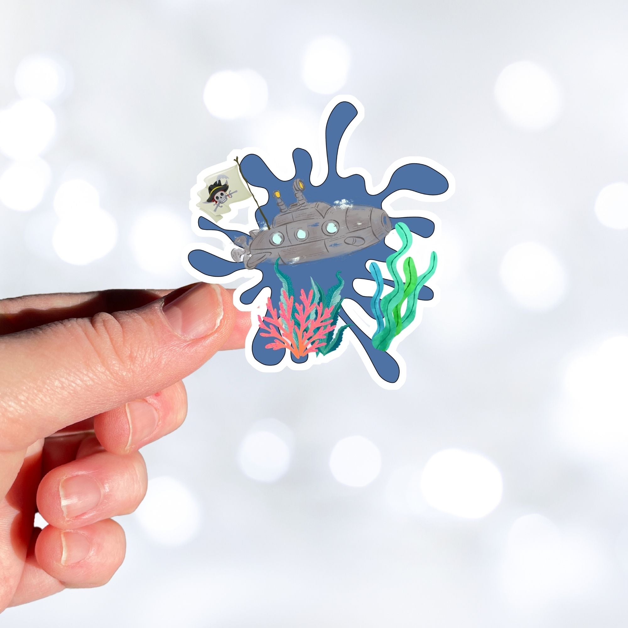Ahoy Matey! This steampunk submarine sticker has a steampunk and a pirate theme. It features a steampunk submarine with a pirate flag on a blue background with coral and underwater plants. This image shows a hand holding the steampunk submarine sticker.