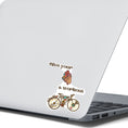 Load image into Gallery viewer, Give your heart a workout! This steampunk sticker has a steampunk anatomic heart and a steampunk bicycle. This image shows the steampunk bicycle sticker on the back of an open laptop.
