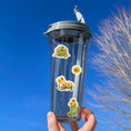 Load image into Gallery viewer, Sunflowers and Gnomes; what a perfect combination! This sticker is filled with stickers of sunflowers and gnomes with sunflowers.  This image shows a water bottle with four stickers applied to it - a gnome house with sunflowers, a single sunflower, a gnome with a wheelbarrow filled with sunflowers, and a boot with sunflowers in it.
