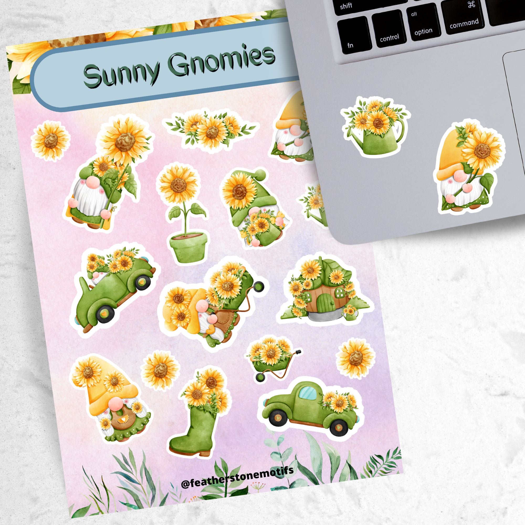 Sunflowers and Gnomes; what a perfect combination! This sticker is filled with stickers of sunflowers and gnomes with sunflowers.  This image shows the sticker sheet next to an open laptop with a watering can filled with sunflowers sticker and a gnome holding a large sunflower sticker applied below the keyboard.