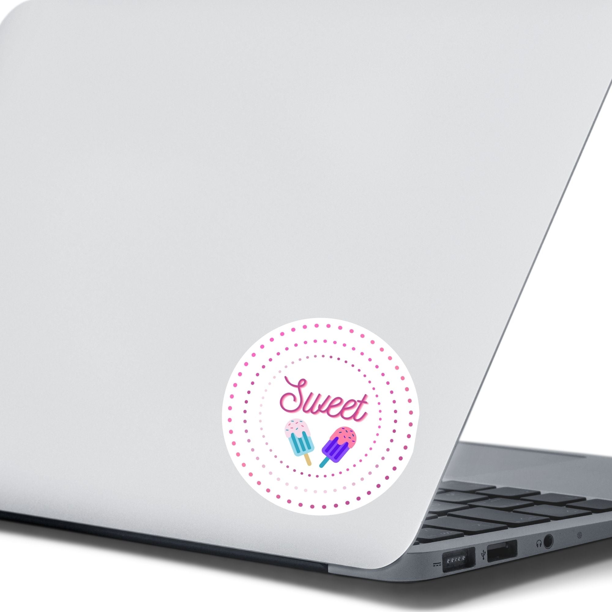 Sweet as Ice Cream! This round individual die-cut sticker has the word Sweet with two ice cream bars in the center surrounded by pink and purple circular dots. This makes a great gift for your sweetie! This image shows the Sweet - Ice Cream sticker on the back of an open laptop.