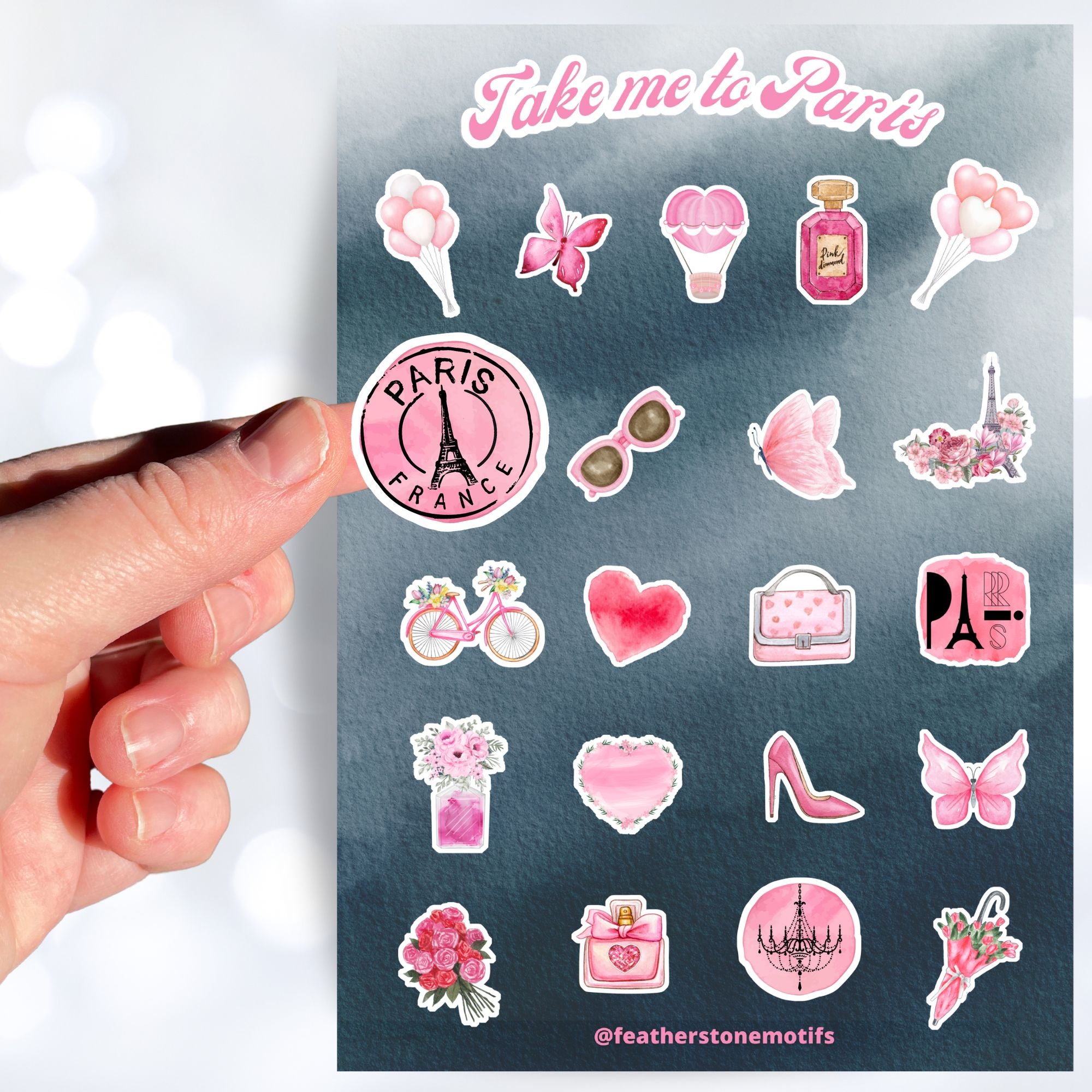  Celebrate everything Paris with this pink aesthetic on a gray background sticker sheet! Images include the Eifel Tower, perfume, balloons, and flowers. This image shows a hand holding a round sticker with an image of the Eifel Tower that says "Paris France" above the sticker sheet. 