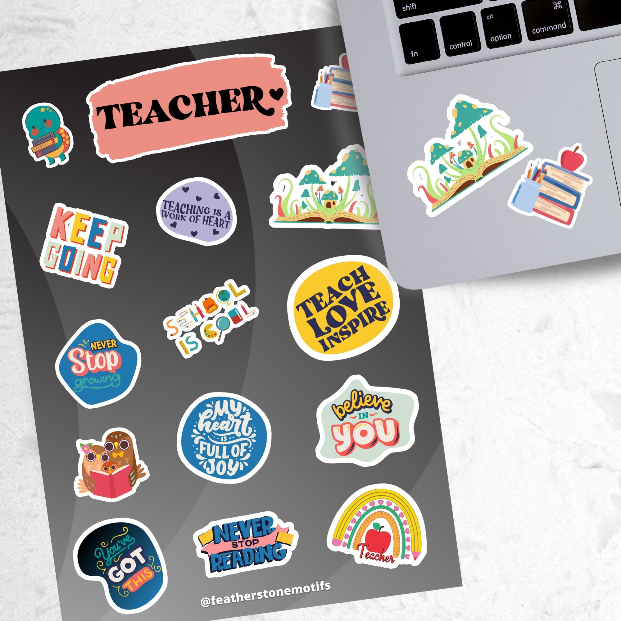 This sticker sheet is great for educators to give to students, or for students to give as a gift to their teacher/educator! The sticker sheet is filled with sticker images like books, and inspirational sayings like "Keep Going", "Never Stop Reading", and "School is Cool". This image shows the sticker sheet next to an open laptop with a sticker of an open book with plants and mushrooms growing out of it, and a sticker of a stack of books with an apple on top, applied below the keyboard.