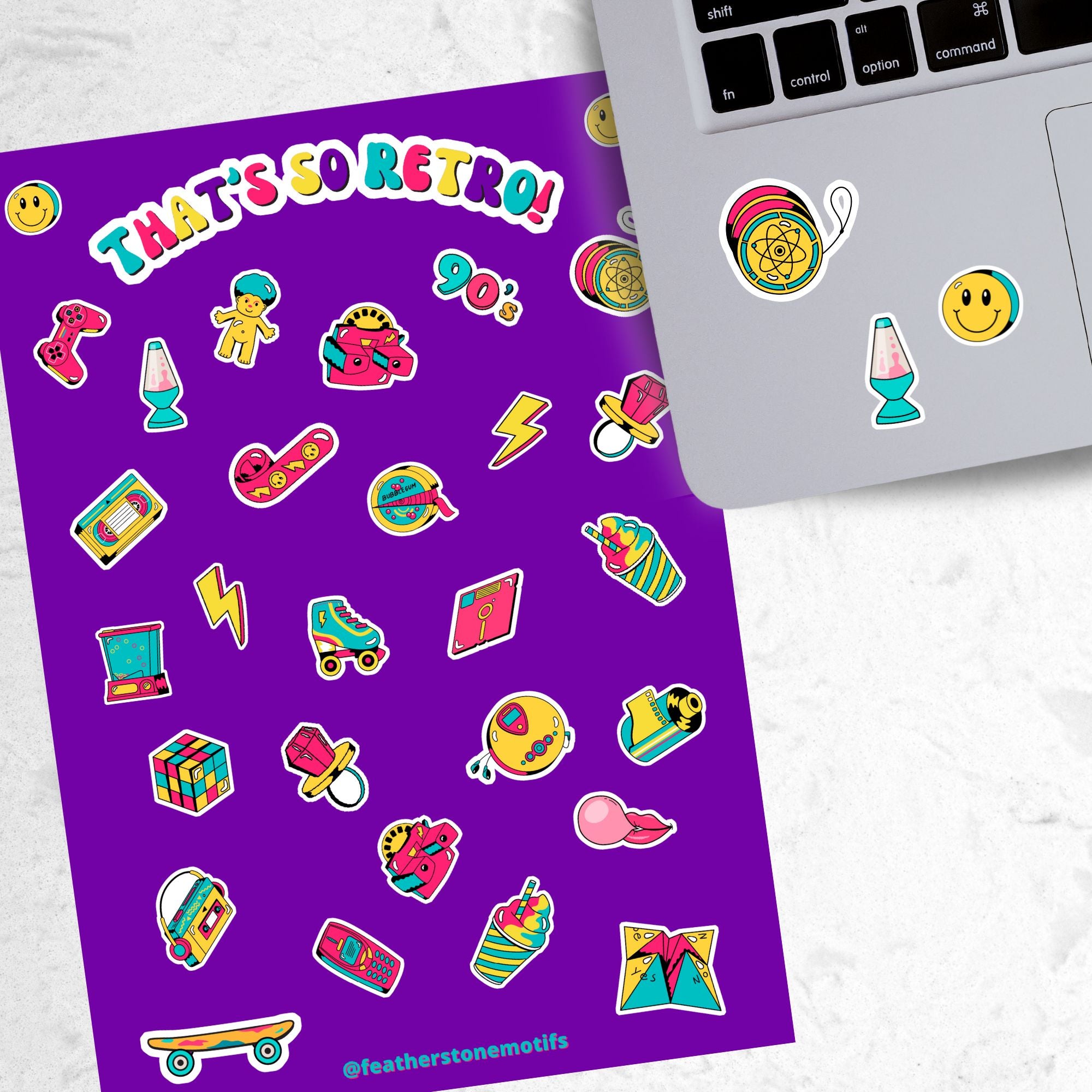 This sticker sheet is filled with images of items from the 70's, 80's, and 90's. Sticker images include a troll doll, roller skate, Rubik's cube, and a skateboard. This image shows the sticker sheet next to an open laptop with stickers of a yo-yo, a smiley face, and a lava lamp, applied below the keyboard.