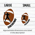 Load image into Gallery viewer, This individual die-cut sticker features the silhouette of a football (American) player about to pass the ball, on a football background, with the word "Touchdown!" on the lower right side. This image shows the large and small touchdown stickers next to each other.
