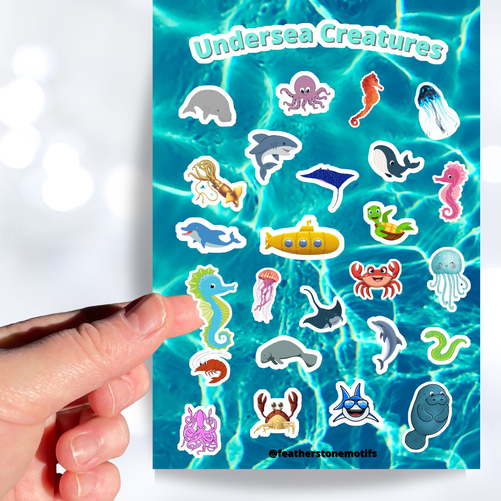 This sticker sheet is filled with fun and cute sticker images of all your favorite undersea creatures! Images include whales, sharks, jellyfish, manatee's, and crabs. There's even a yellow submarine! This image shows a hand holding a sticker of a blue and green seahorse above the sticker sheet.