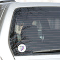 Load image into Gallery viewer, This individual die-cut sticker features a teal and purple unicorn with stars in the background. This image shows the teal and purple Unicorn sticker on the back window of a car.
