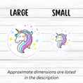 Load image into Gallery viewer, This individual die-cut sticker features a teal and purple unicorn with stars in the background. This image shows large and small Unicorn stickers next to each other.
