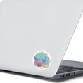 Load image into Gallery viewer, This underwater scene features corals, sand, and a pastel watercolor background on an individual die-cut sticker. With this sticker you can take the reef with you anywhere you go! This image shows the Watercolor Reef sticker on the back of an open laptop.
