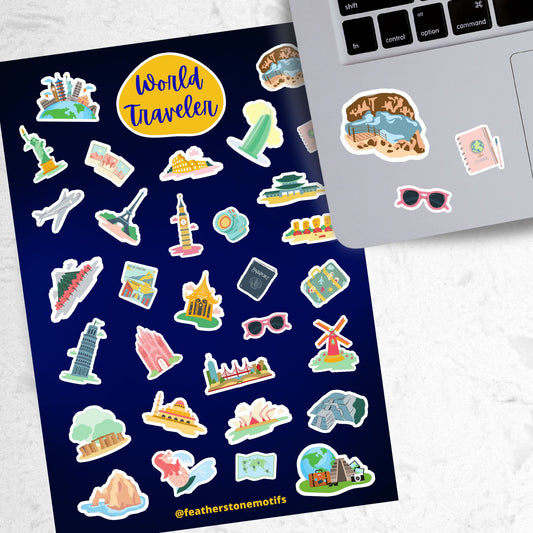 Our World Traveler sticker sheet has sticker images of iconic travel destinations! This sheet has a black background with over 30 different stickers including the Statue of Liberty, Easter Island, Stonehenge, and a passport and camera. This image shows the sticker sheet next to an open laptop with stickers of the Grand Canyon, sunglasses, and a travel notebook and pen, applied below the keyboard.