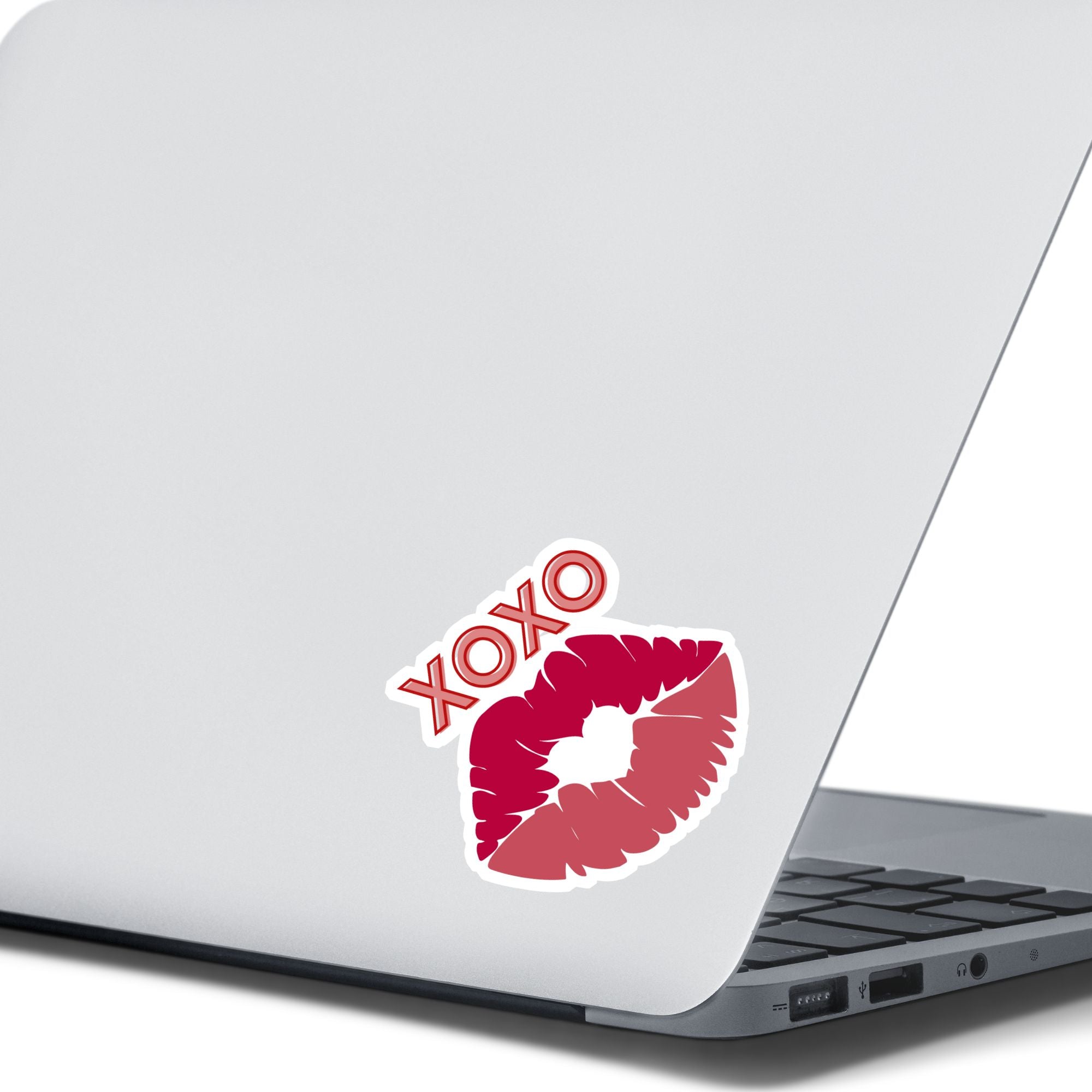 This individual die-cut sticker pretty much speaks for itself! It features a pair of lips with XOXO written above. Nuff said!  This image shows the XOXO die-cut sticker on the back of an open laptop.
