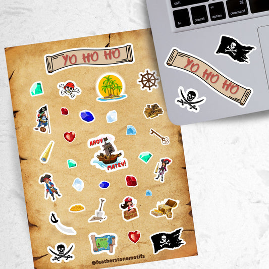 Yo Ho Ho, a Pirate's Life for Me! This sticker sheet is a treasure-worthy find for any pirate with images of the Jolly Roger, treasure, maps, pirates, and a pirate ship. This image is of the sticker sheet next to a laptop with stickers of a pirate's flag with skull and crossbones, the sticker sheet header reading Yo Ho Ho, and a skull and crossed swords, applied below the keyboard. 