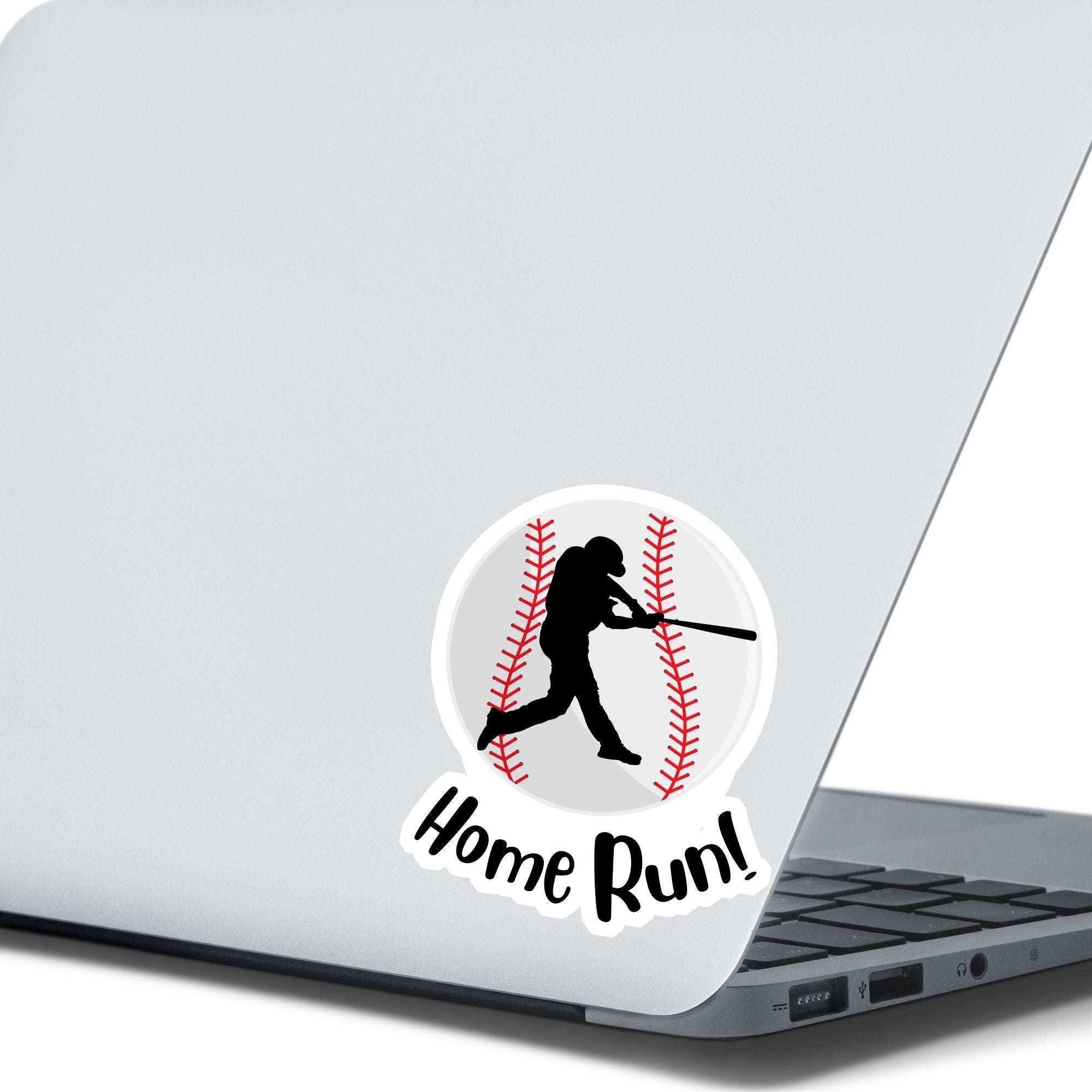 Knock it out of the park! This individual die-cut sticker features the silhouette of a baseball player swinging a bat, on a background of a baseball, with the word "Homerun!" below. This image shows the baseball sticker on the back of an open laptop.