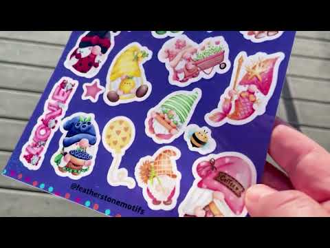 Video of Featherstone Motifs sparkle sticker sheets in the sun.